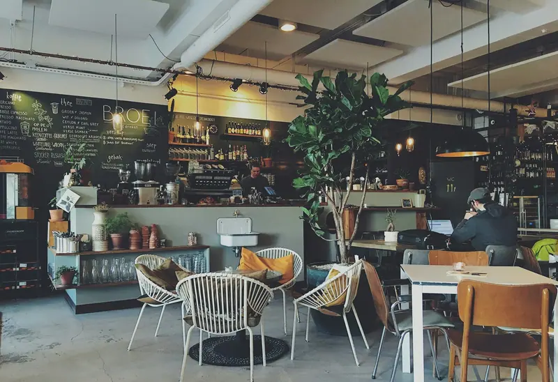 Interior of a modern dessert parlour with seating and feature lighting